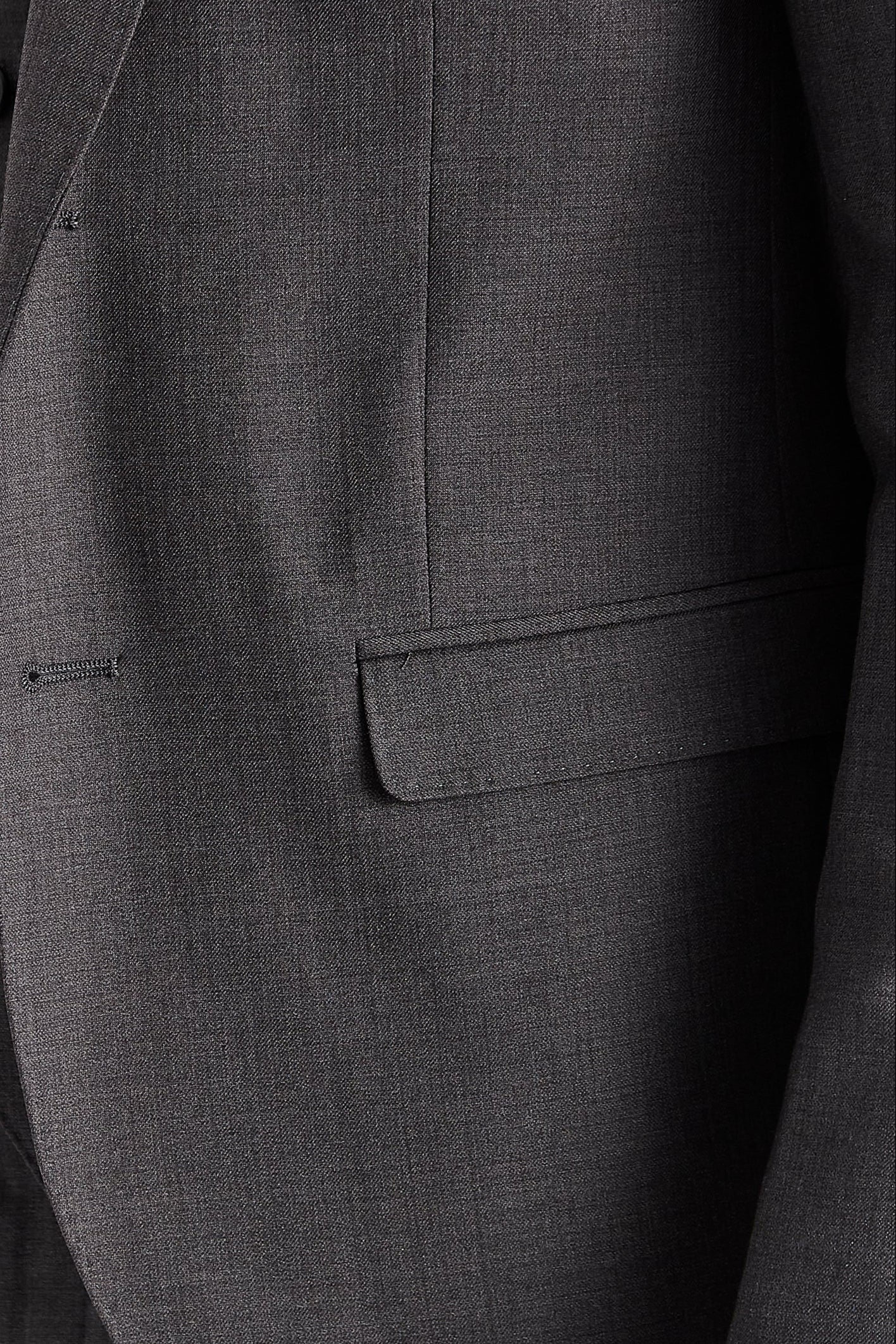 Close-up of the front pocket on the Charles Men's Charcoal Blazer , highlighting the dark grey fabric.