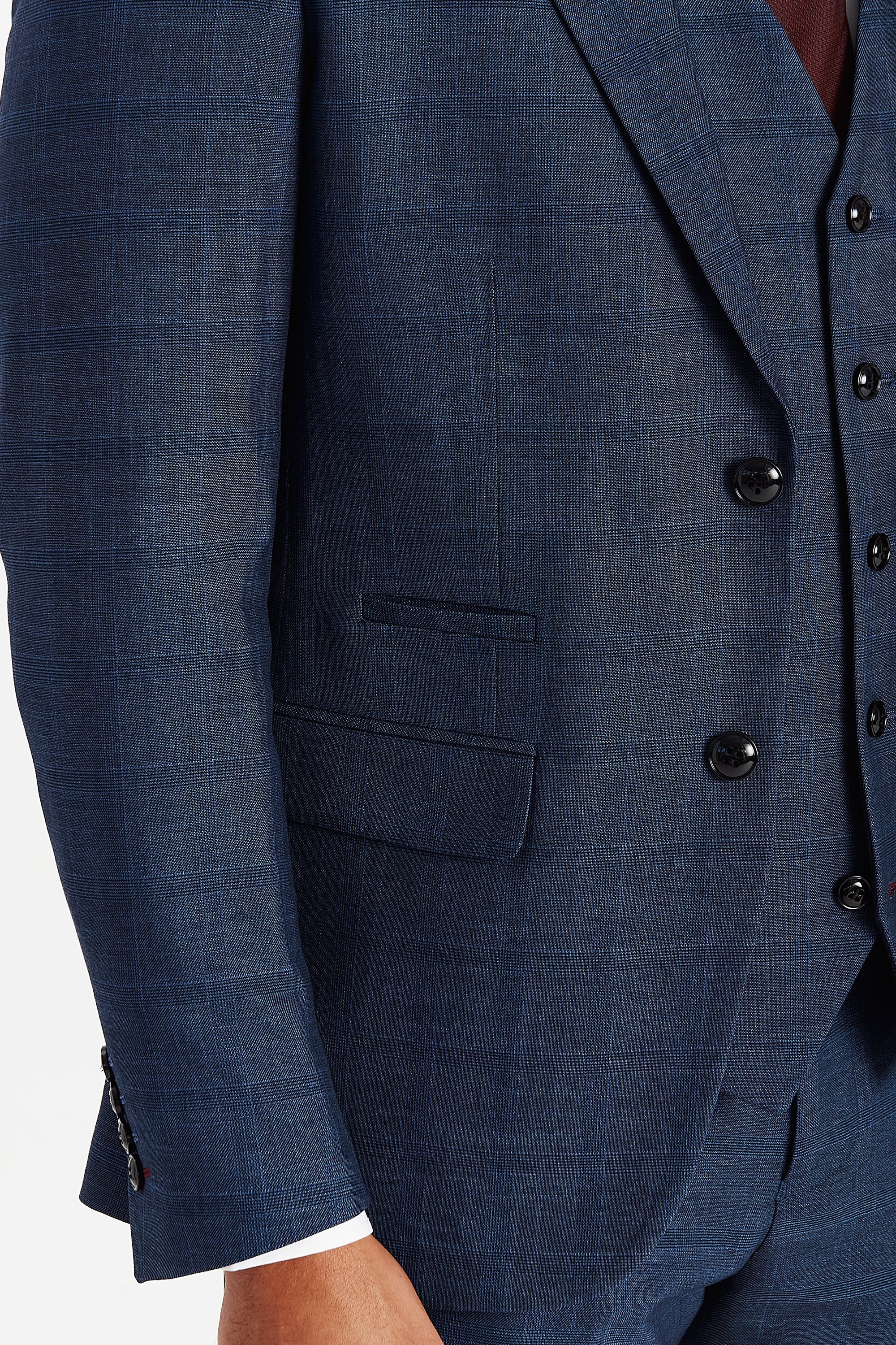 Close-up view of the Viceroy navy check blazer showing the subtle check pattern, black buttons, a front flap pocket and matching upper pocket trim.