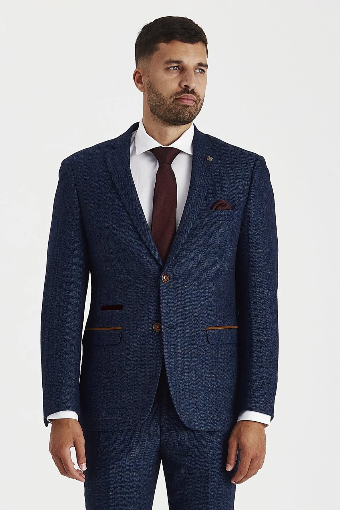 Front view of the Scott navy tweed check blazer, worn with matching trousers, a white shirt, burgundy tie and burgundy pocket square.