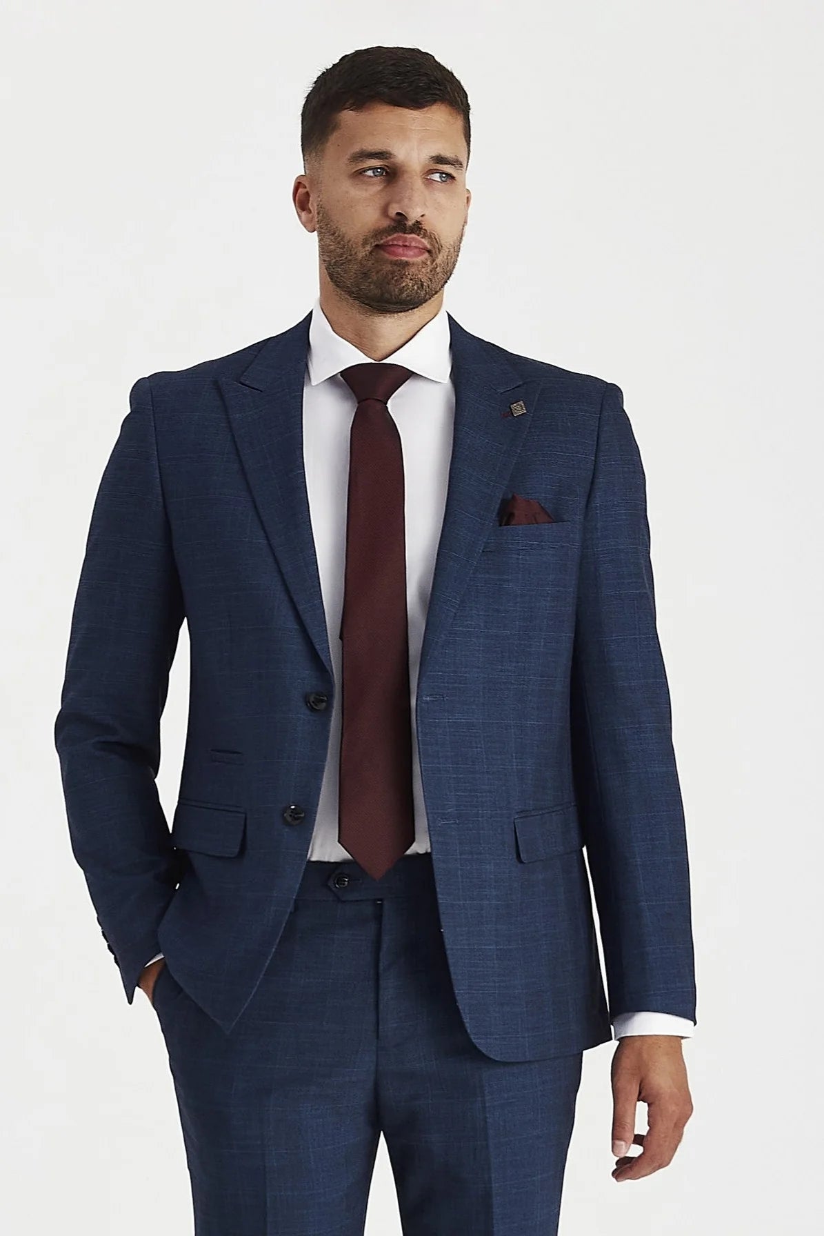 Paul Andrew Viceroy navy check two-piece suit with peak lapel, styled with white shirt and burgundy tie