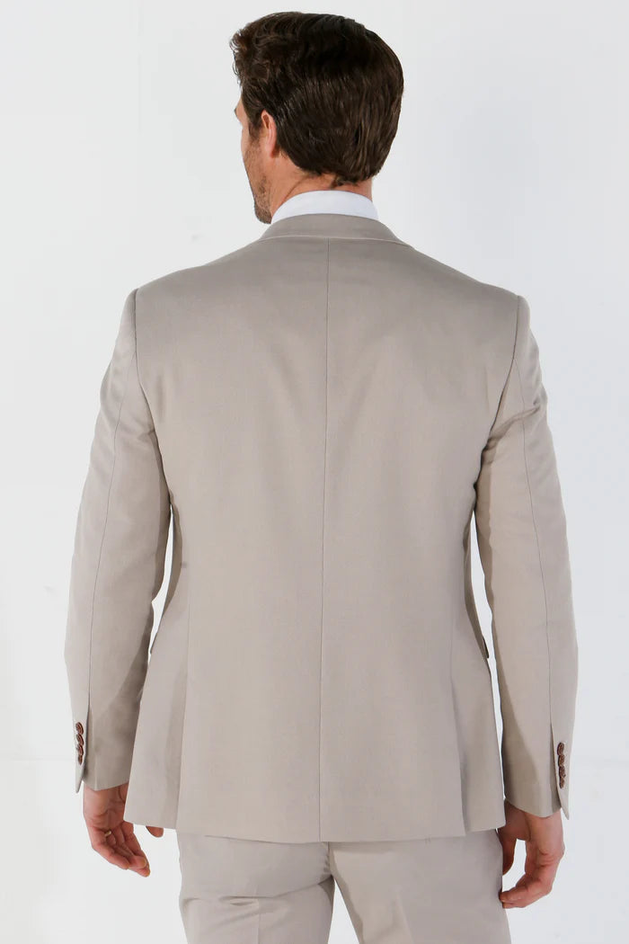 ear view of the stone blazer highlighting clean seams, fitted structure, and subtle shoulder tailoring.