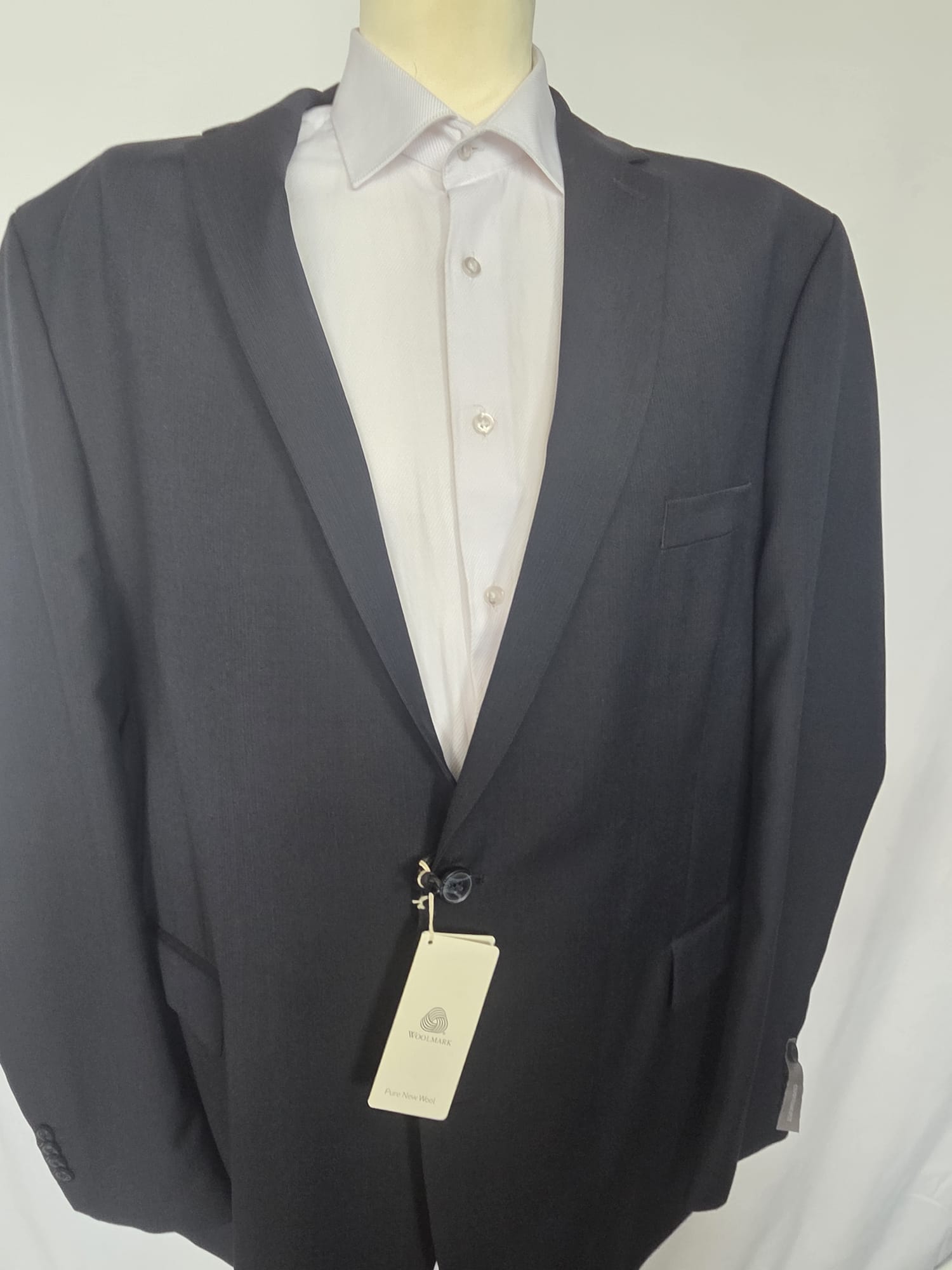 Front view of dark navy Thomas Goodwin two-piece suit jacket with notch lapel and two-button closure.